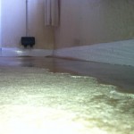 Water sitting on a loop pile nylon carpet. We removed this as quickly as possible to ensure that it caused as little secondary damage as possible; we did not want the skirting boards or cavity wall insulation soaking up the water as it would take longer to dry. Water Damage .co.uk conducted an exercise in damage limitation in the fastest way possible!